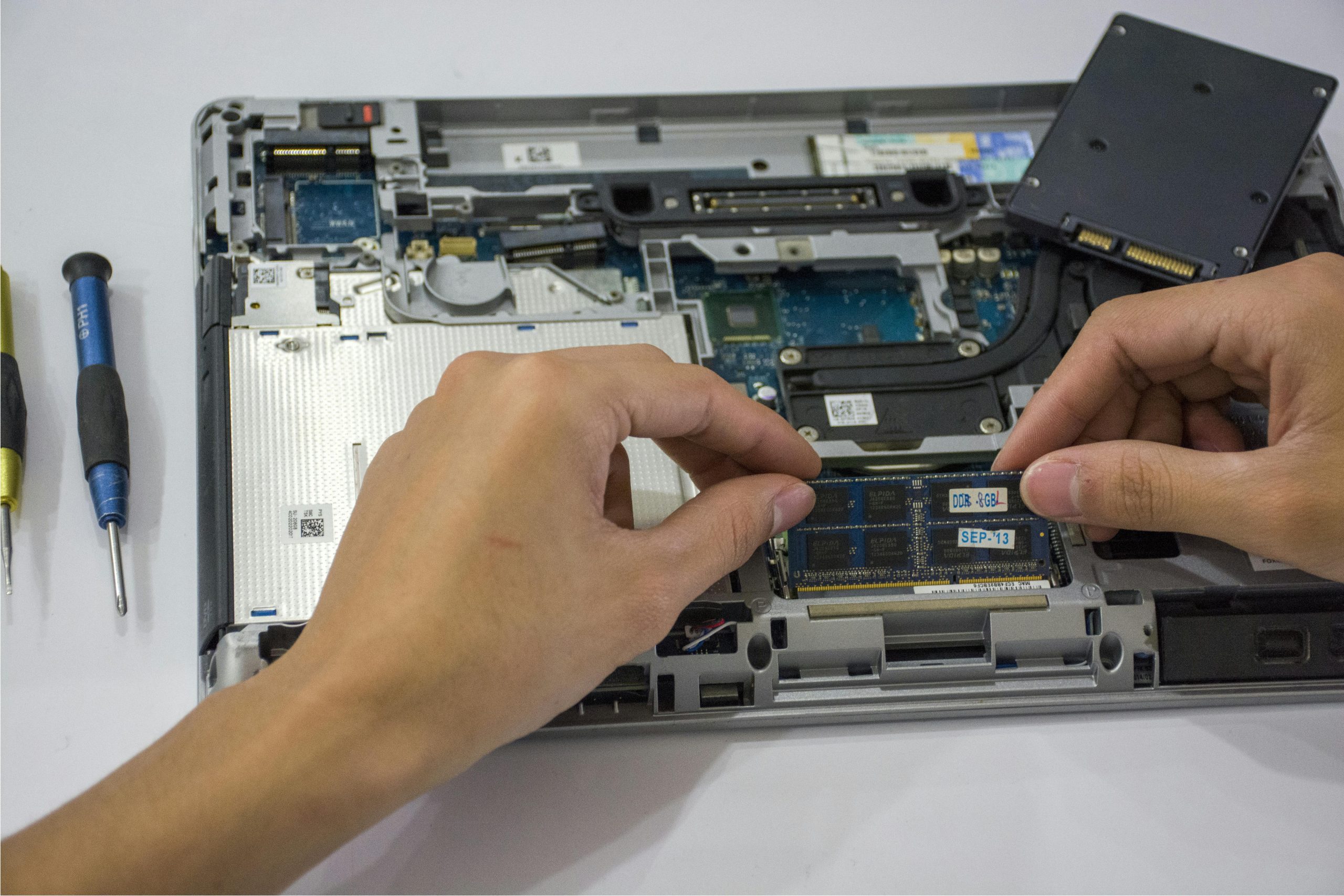 Professional technician performing on-site IT hardware repair for a business server.