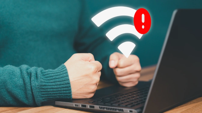 Wireless router with blinking red warning lights indicating slow WiFi or a dropped connection.