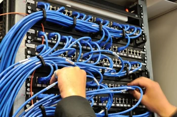 Man-connecting-network-cables A man connecting network cable